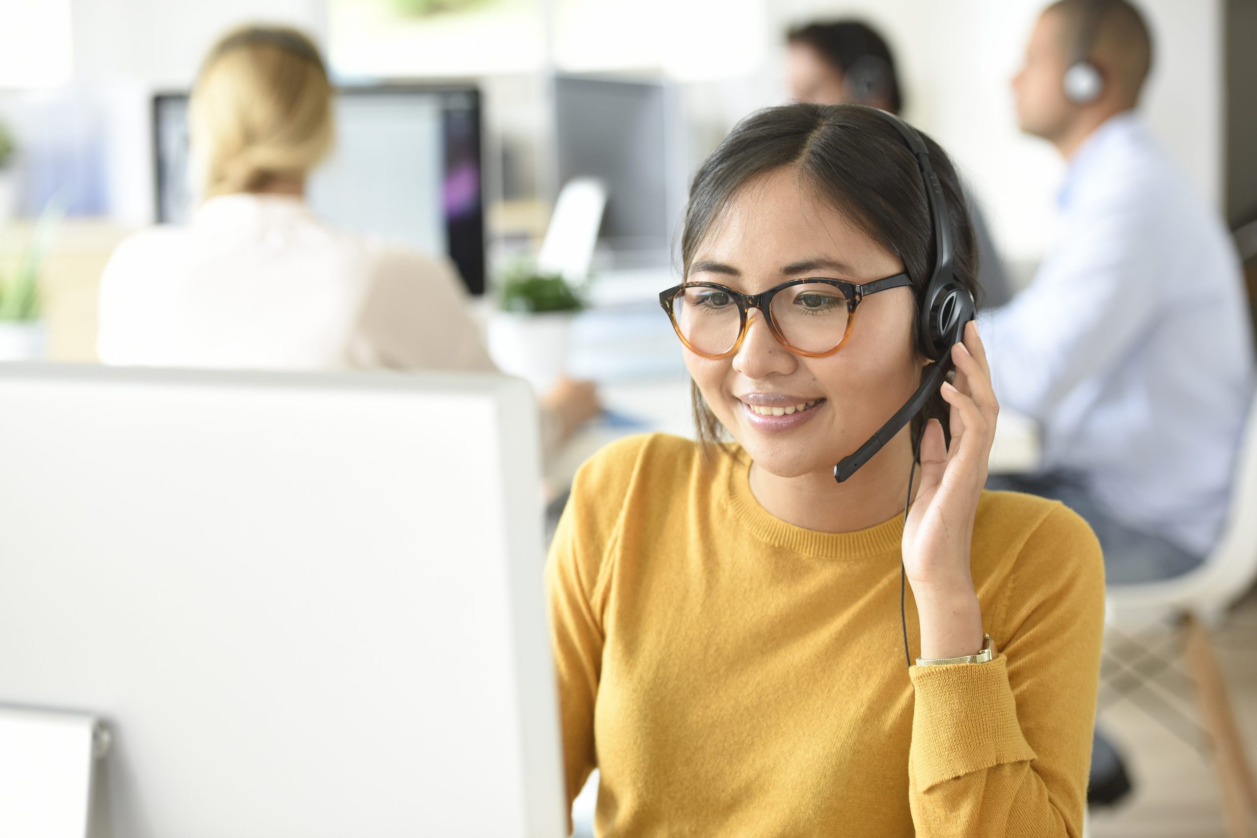 Customer service assistant working in office Customer service assistant working in office