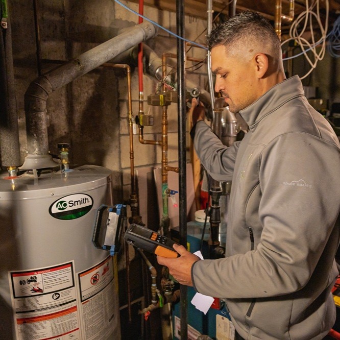 HomeWorks Energy Specialist conducts a Combustion Safety Test in a Massachusetts home