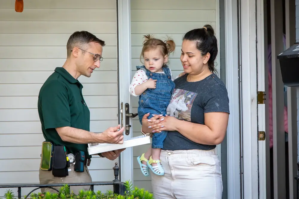 HomeWorks Technician Shows Customer Energy-Efficiency Savings Measures