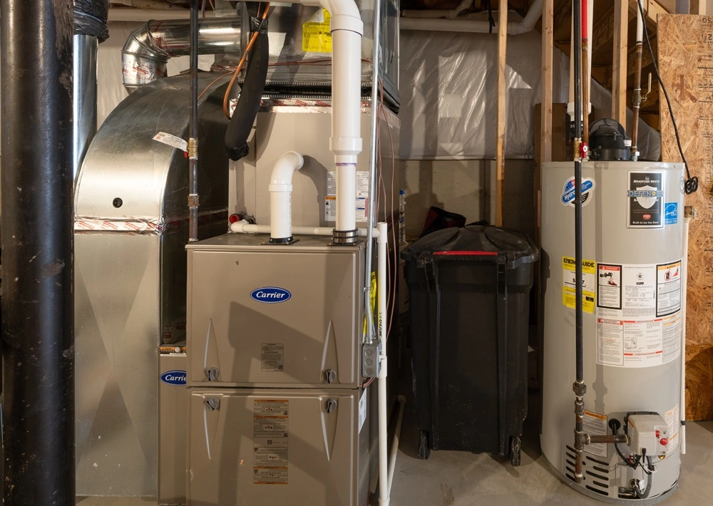 HVAC system and water heater service in Massachusetts basement