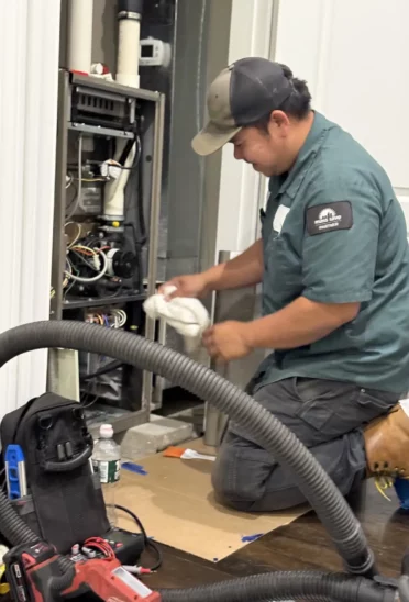 HomeWorks Energy Technician performing Preventative HVAC Maintenance